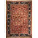 Persian Rug , red ground, dark blue border, overall stylized floral design, 13 ft. 8 in. x 19 ft.