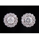 Pair of 18 kt. White Gold and Diamond Earrings , each prong set with center round brilliant cut