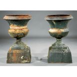Pair of American Cast Iron Garden Urns , 19th c., bird motif, associated plinth base, h. 24 3/4 in.,