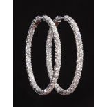Pair of 14 kt. White Gold and Diamond Hoop Earrings , each oval hoop prong set with 19 round