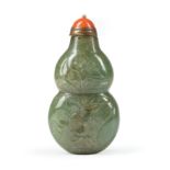 Chinese Green Jade Double-Gourd Form Snuff Bottle , carved with floral sprays, h. 2 3/4 in