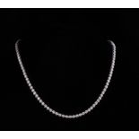 18 kt. White Gold and Diamond Necklace , comprised of 112 half bezel set diamonds, total wt. approx.