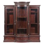 American Aesthetic Carved Mahogany Triple Bookcase , molded cornice, bowknot frieze with acorns