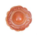 Chinese Agate Pendant , carved with central boss flanked by c-scrolls, reverse with conch shell,