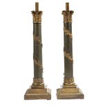Pair of Continental Patinated and Gilt Metal Columnar Lamps , Corinthian capitals, stepped bases, h.