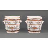 Pair of French Porcelain Wine Coolers , polychrome floral decoration with gilt accents, molded