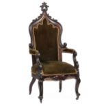 American Gothic Carved Mahogany Armchair , c. 1840, finialed high back, padded arms with lappet