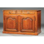 French Provincial Carved Walnut Buffet Bas , 18th c., molded top, frieze fitted with three drawers