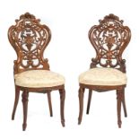 Pair of American Rococo Carved Rosewood "Fancy" Chairs , mid-19th c., New York, attr. to J. & J.W.