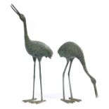 Pair of Large Bronze Garden Figures of Cranes , one upright, one feeding, taller h. 38 in., w. 6 3/4