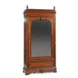 American Renaissance Carved Mahogany Single Door Armoire , late 19th c., finialed crest, canted cove