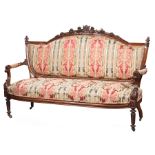 Pair of American Renaissance Carved Rosewood and Grained Settees , c. 1860, bowknot centered