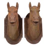Pair of Large Cast Iron Race Horses , patinated surface, h. 30 in., w. 13 in., d. 22 in