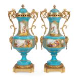 Pair of Large Sevres-Style Gilt Bronze-Mounted "Bleu Celeste" Covered Urns , scroll and ram's head