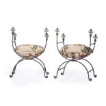 Pair of Continental Wrought Iron Curule Chairs , fleur-de-lis finials, incised frame, griffin