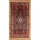Persian Malayer Carpet , repeating motifs of lions and florals, 5 ft. x 9 ft. 7 in