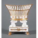 Paris Porcelain Parcel Gilt Navette-Form Corbeille , 19th c., bisque winged lion supports, paw feet,