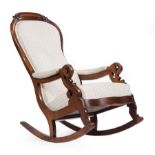 American Late Classical Walnut Lincoln Rocker , scroll and foliate crest, padded arms, pierced