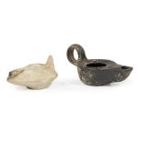 Two Ancient Roman or Greek Pottery Oil Lamps , larger h. 2 1/8 in., w. 4 1/2 in., d. 2 1/4 in