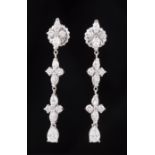 Pair of 18 kt. White Gold and Diamond Dangle Earrings , each comprised of 3 floral clusters with 2