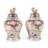 Pair of Imari-Style Covered Jars , 20th c., gilt Buddhist lion finials, decorated with textile
