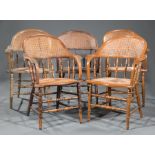 Group of Five Capatain's Chairs , c. 1880-1900, barrel form, caned and spindled backs, caned