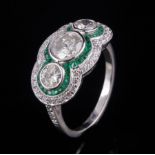 Platinum, Diamond and Emerald Ring , center bezel set round brilliant cut diamond, wt. approx. 1.