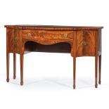 George III-Style Figured Mahogany Sideboard , shaped top, conforming case with center drawer flanked