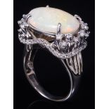 14 kt. White Gold, Opal and Diamond Ring , center prong set oval cabochon opal, wt. approx. 4.51