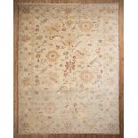 Sultananbad Carpet , khaki ground, stylized floral design, 10 ft. x 13 ft Provenance: Jacqueline