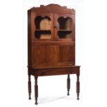 Mississippi Walnut Secretary Bookcase Desk , 19th c., spurred shaped crest, glazed doors, fall front