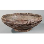 Large Asian Basket , 20th c., h. 10 3/4 in., dia. 31 in