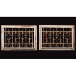 Pair of New Orleans Wrought Iron Window Grilles , 19th c., scroll design, rustic molded wood