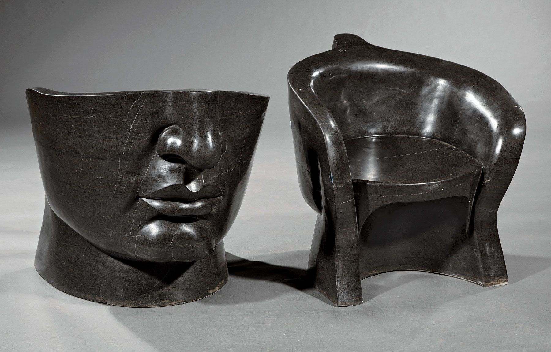 Pair of Art Moderne-Style Black Marble Face Chairs , barrel-form seats, h. 27 in., w. 25 in., d.