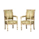 Pair of French Consulat Crème Peinte and Parcel-Gilt Fauteuils , late 18th/early 19th c., molded