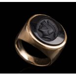 14 kt. Yellow Gold and Onyx Intaglio Ring , round onyx carved with the profile of a Classical