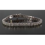 14 kt. White Gold and Diamond Tennis Bracelet , set with 37 round diamonds totally 12.35 cts., J