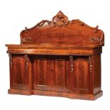 Regency Carved Mahogany Sideboard , 19th c., foliate and scroll bookmatched backsplash, one long and