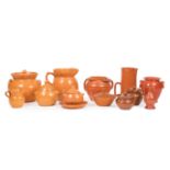 Twelve Pieces of North Carolina Pottery , incl. 7 Jugtown Pottery orange glazed covered vessels