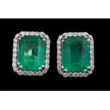 Pair of Platinum, Emerald and Diamond Earrings , center prong set octagonal step cut emeralds, total