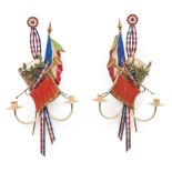 Pair of French Tole Peinte Tricolor Trophee Two-Light Sconces , 20th c., with drum, trumpet, and