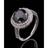 14 kt. White Gold and Black Diamond Ring , center prong set round brilliant cut diamond, wt. approx.