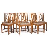 Eight German Art Deco Oak Dining Chairs , c. 1930, incl. one arm, and 7 sides, geometric backs,