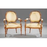 Pair of Louis XVI-Style Carved Rosewood Fauteuils , molded back, scrolled and padded arms, shaped