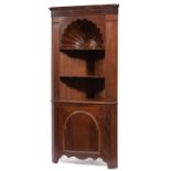 Carved Mahogany Corner Cabinet , molded cornice, carved shell over three open shelves, lower