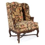 Regence-Style Carved Walnut Bergere a Oreilles , 19th c., needlepoint upholstery with nailhead trim,