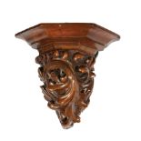 Pair of American Carved Walnut Corner Brackets , 19th c., oak leaf decoration, h. 7 in., w. 8 in.,