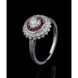 18 kt. White Gold, Diamond and Ruby Ring , center prong set round brilliant cut diamond, wt. 0.36