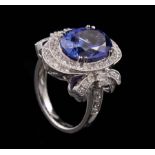 Platinum, Tanzanite and Diamond Ring , center oval brilliant cut crown modified brilliant cut