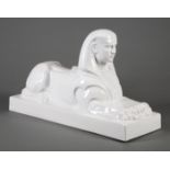 Continental Glazed Ceramic Sphinx , plinth base, h. 14 1/4 in., w. 23 1/2 in., d. 8 1/2 in